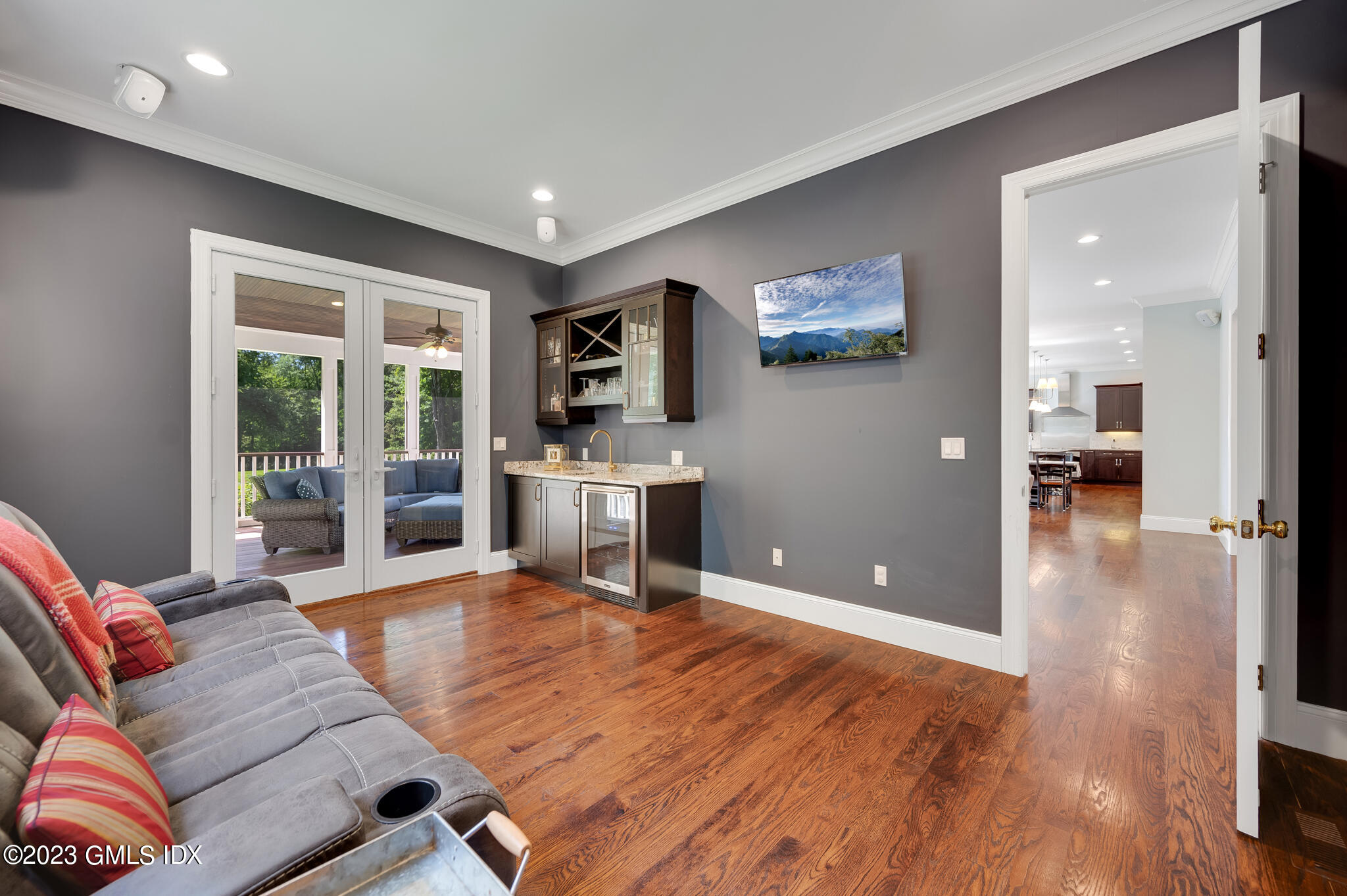 58 Perkins Road Greenwich, CT 06830 - Photo 13 of 30 a living room with furniture and a flat screen tv