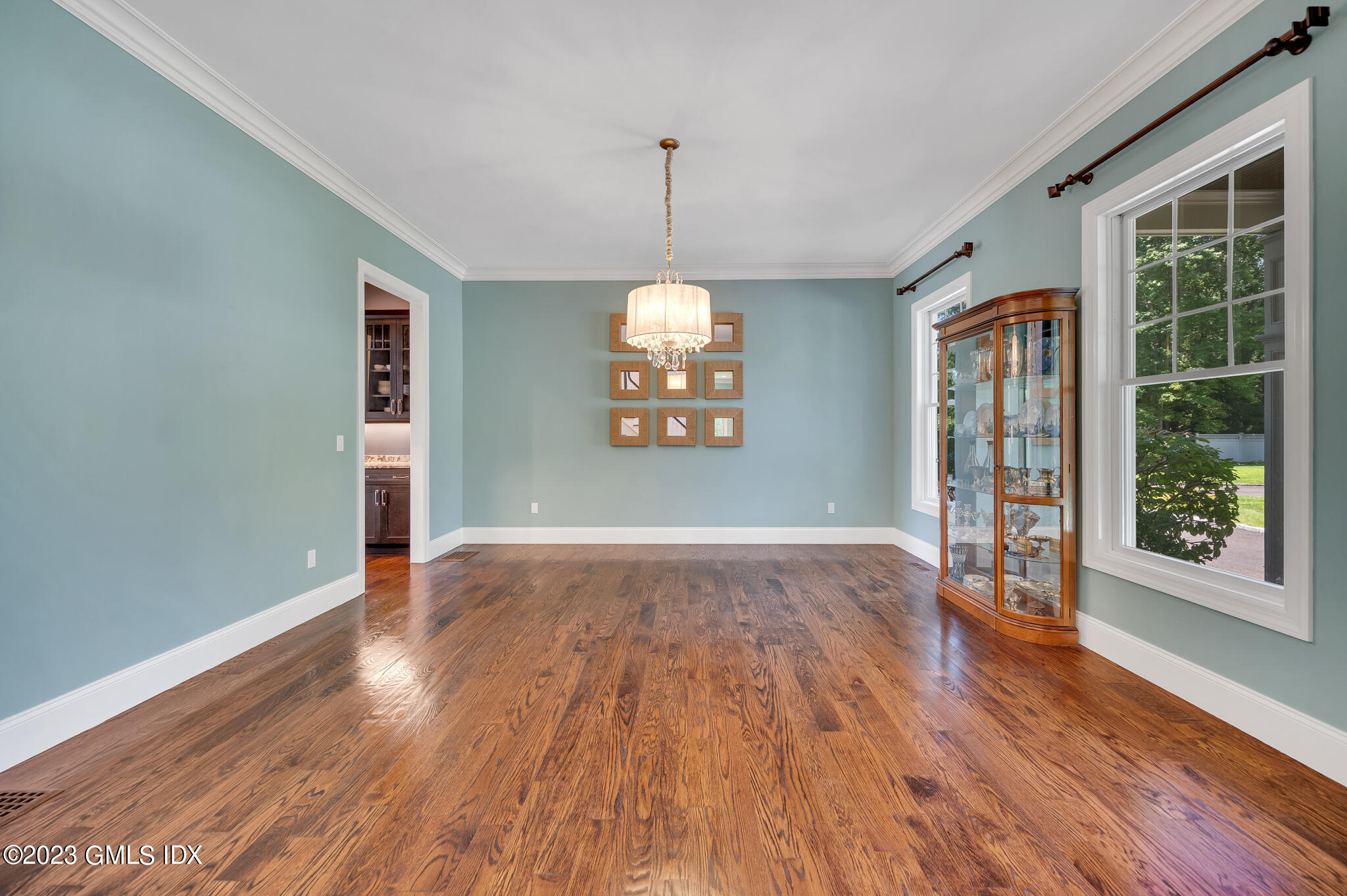 58 Perkins Road Greenwich, CT 06830 - Photo 15 of 30 an empty room with wooden floor and windows