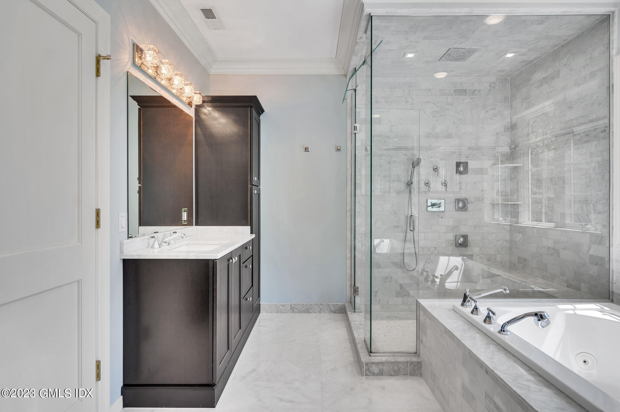 58 Perkins Road Greenwich, CT 06830 - Photo 20 of 30 a bathroom with a granite countertop tub sink shower and mirror