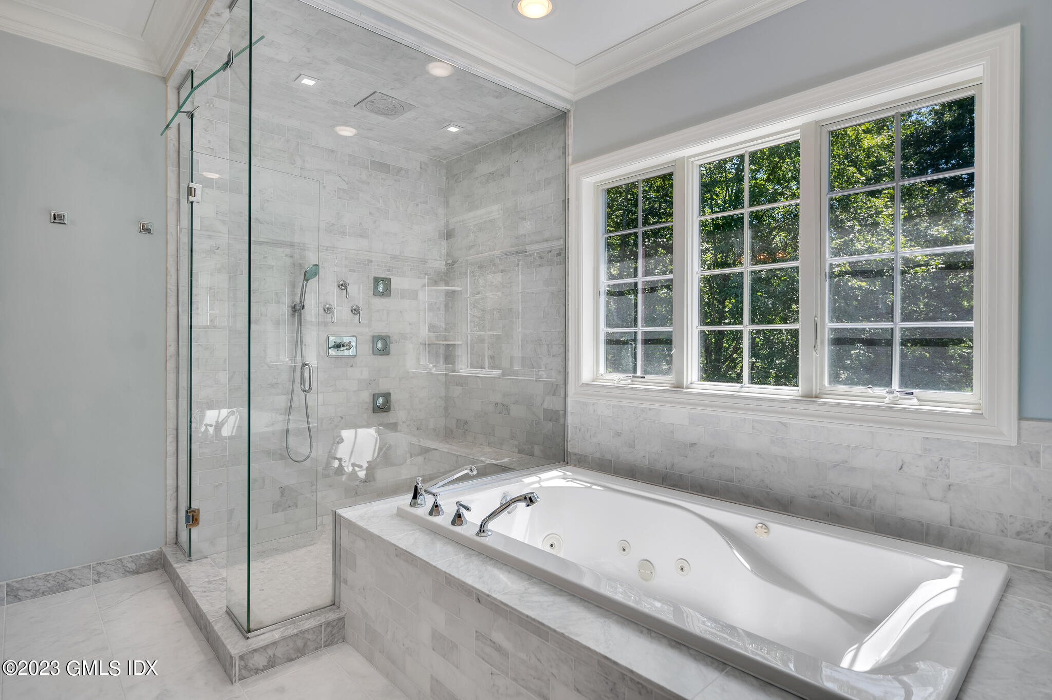 58 Perkins Road Greenwich, CT 06830 - Photo 21 of 30 a bathroom with a tub a sink and a window