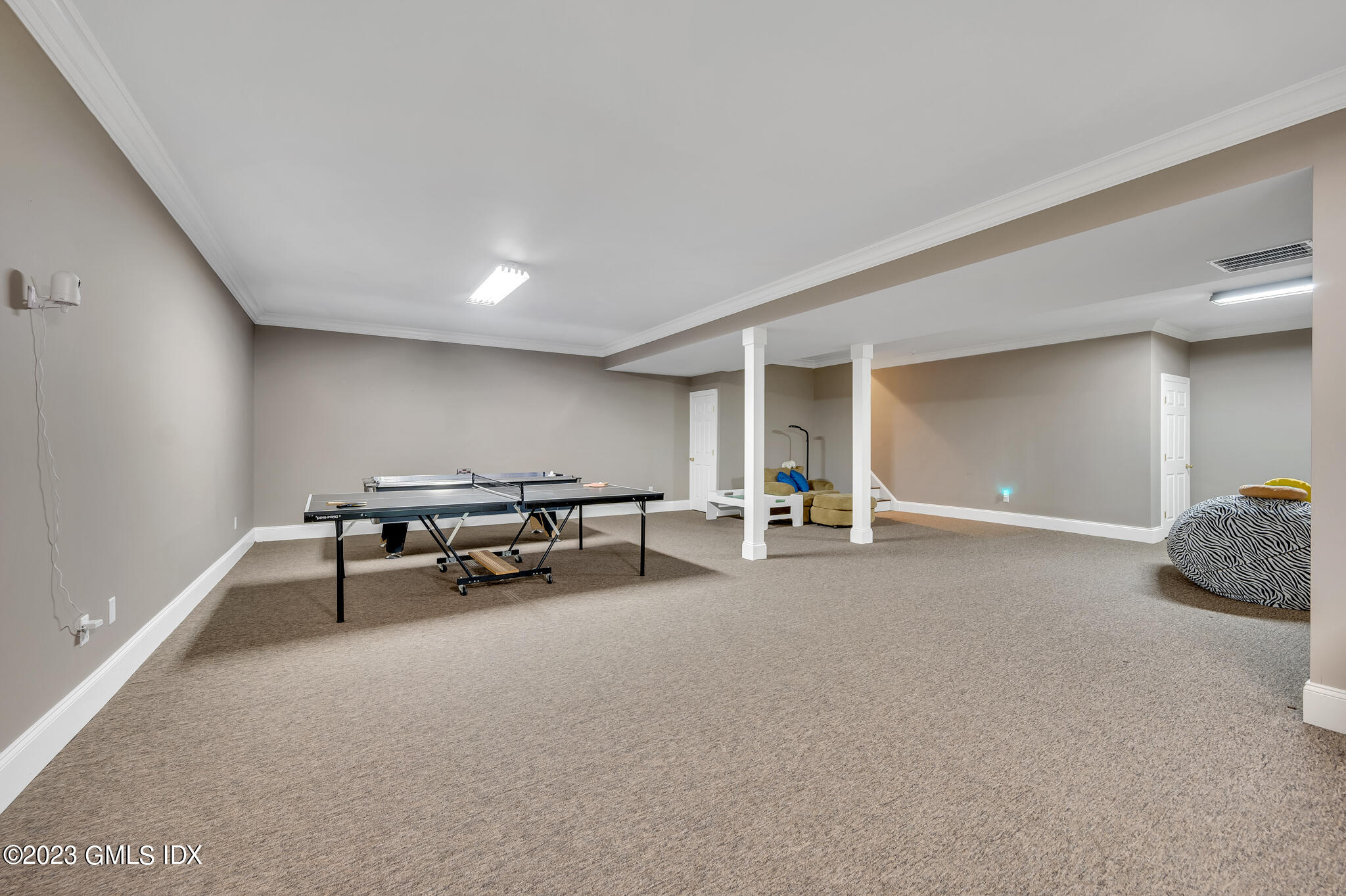 58 Perkins Road Greenwich, CT 06830 - Photo 22 of 30 a living room with furniture and a couch