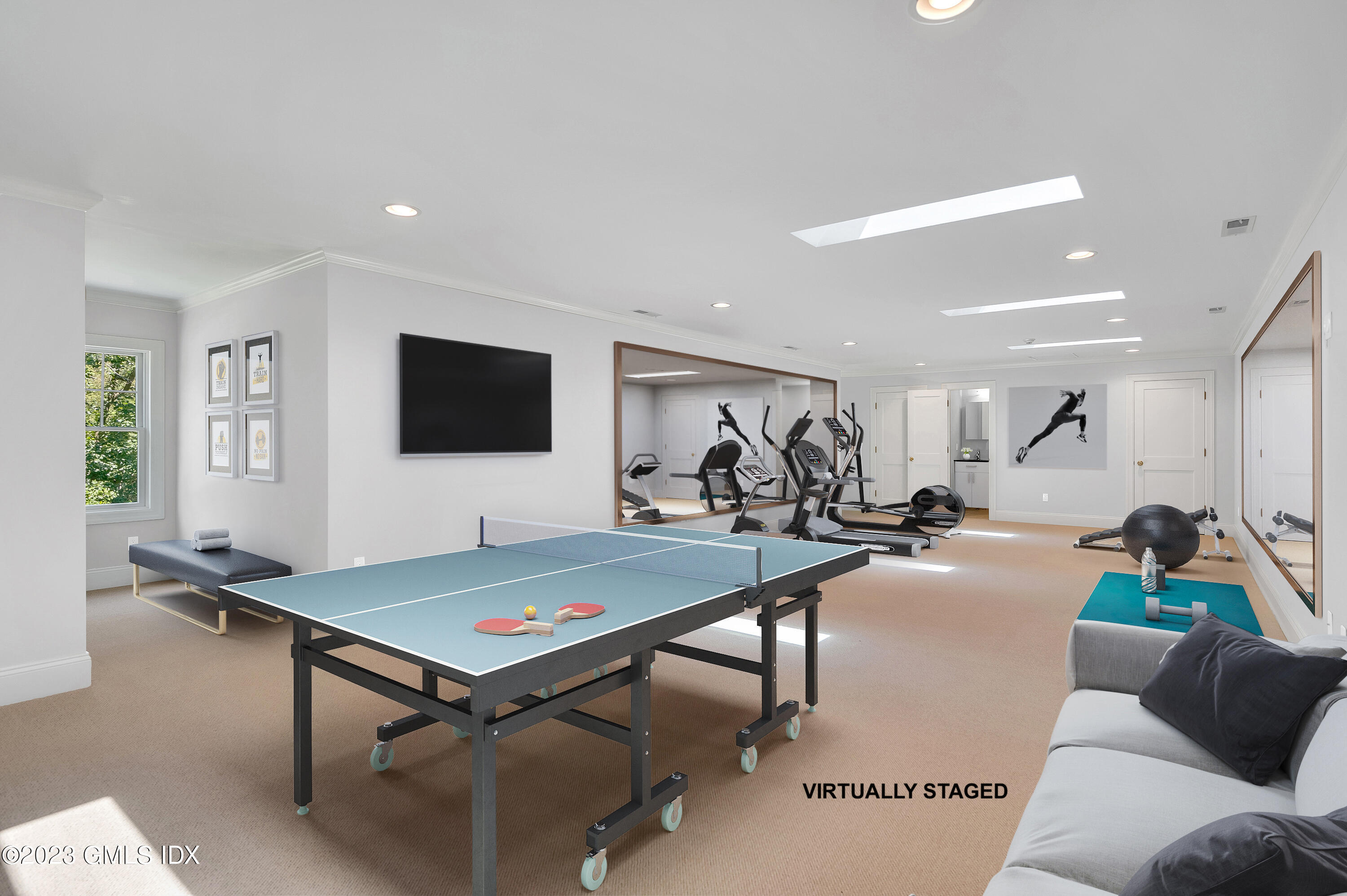 58 Perkins Road Greenwich, CT 06830 - Photo 25 of 30 a living room with furniture and a flat screen tv