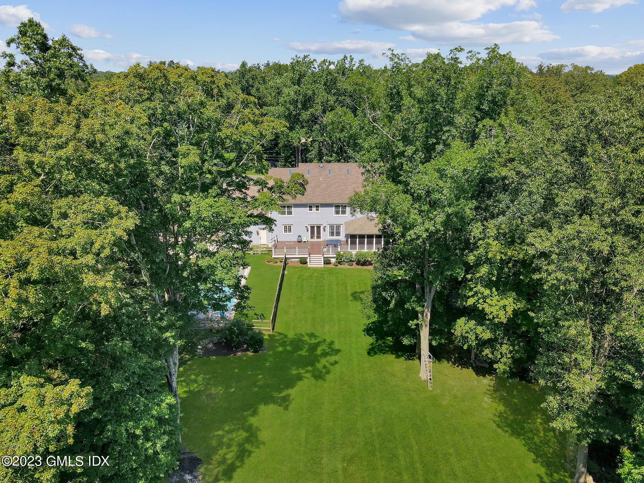 58 Perkins Road Greenwich, CT 06830 - Photo 27 of 30 an aerial view of a house with a yard