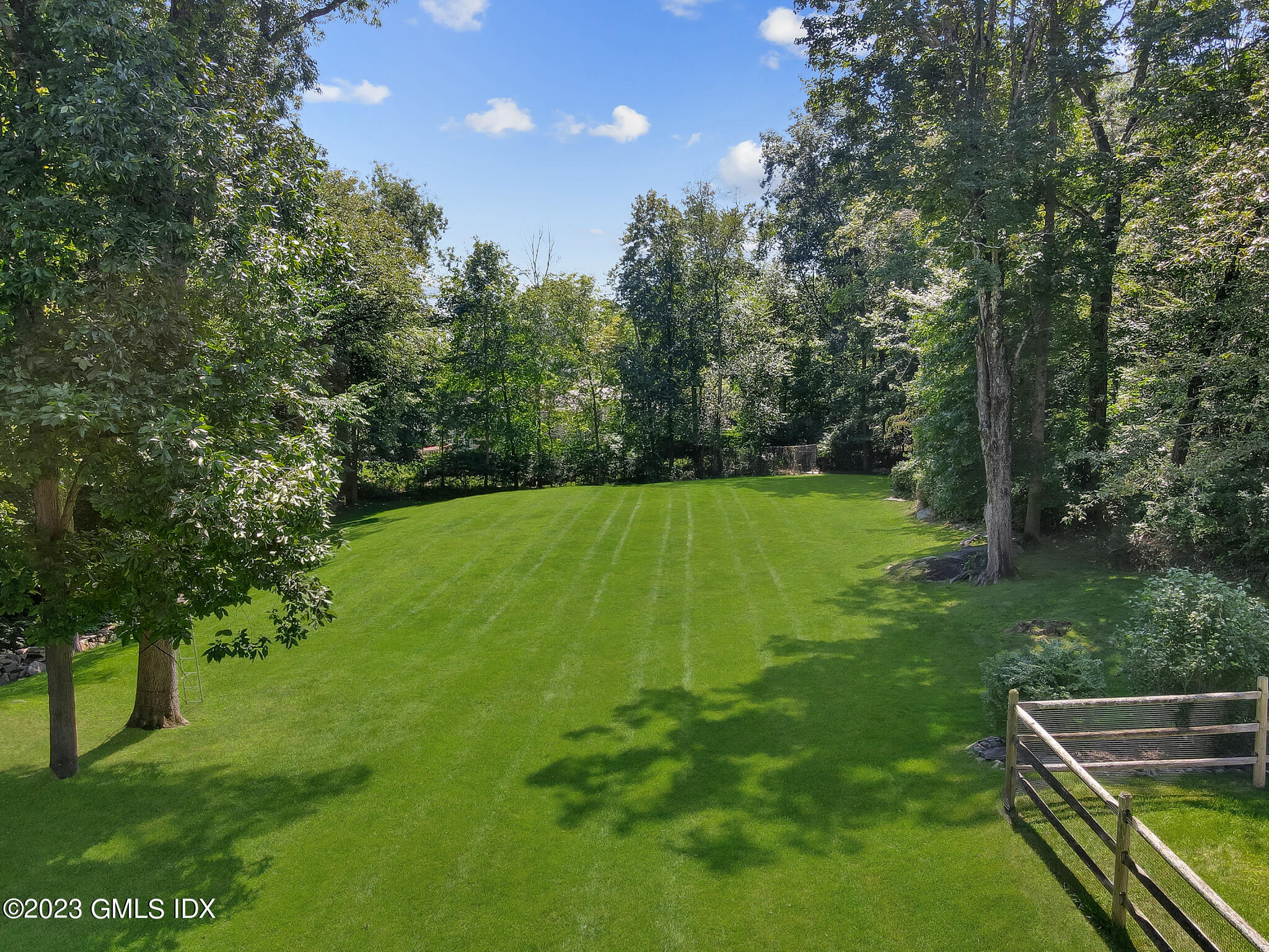 58 Perkins Road Greenwich, CT 06830 - Photo 28 of 30 a view of a yard with a large trees