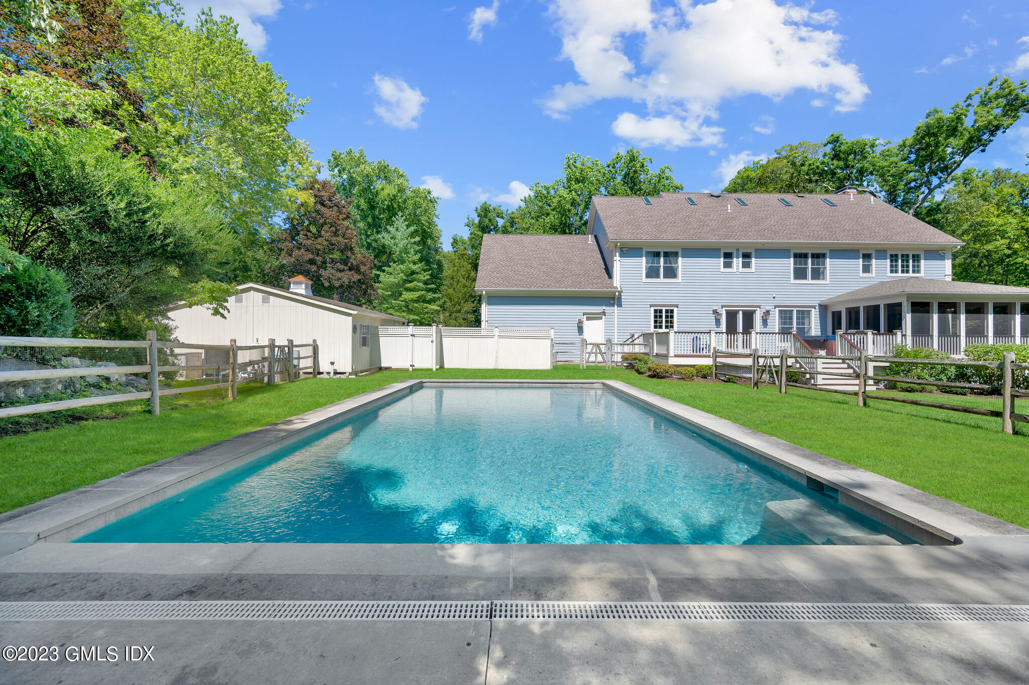 58 Perkins Road Greenwich, CT 06830 - Photo 30 of 30 a view of a house with a swimming pool