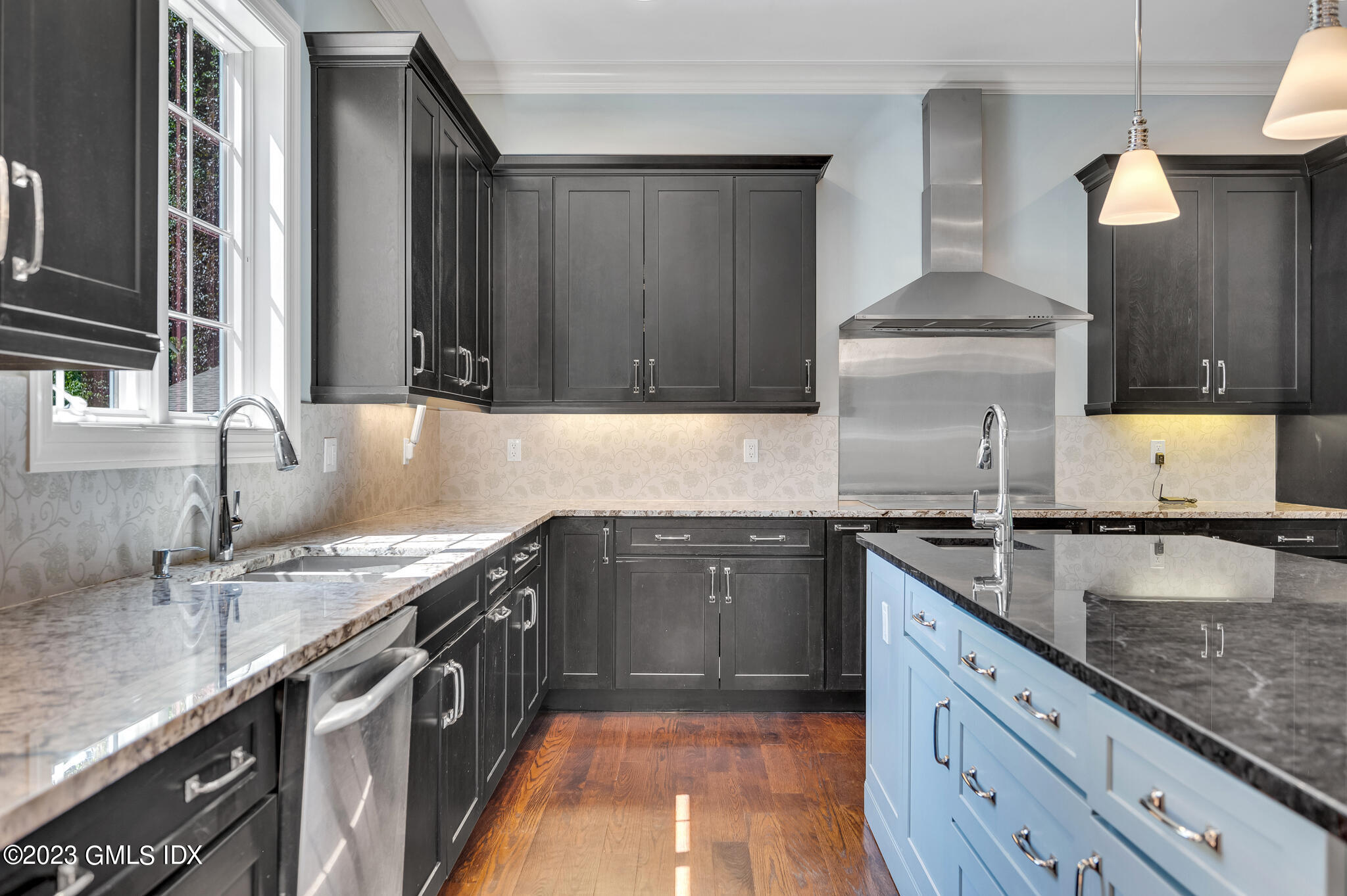 58 Perkins Road Greenwich, CT 06830 - Photo 5 of 30 a kitchen with stainless steel appliances granite countertop a sink stove and cabinets