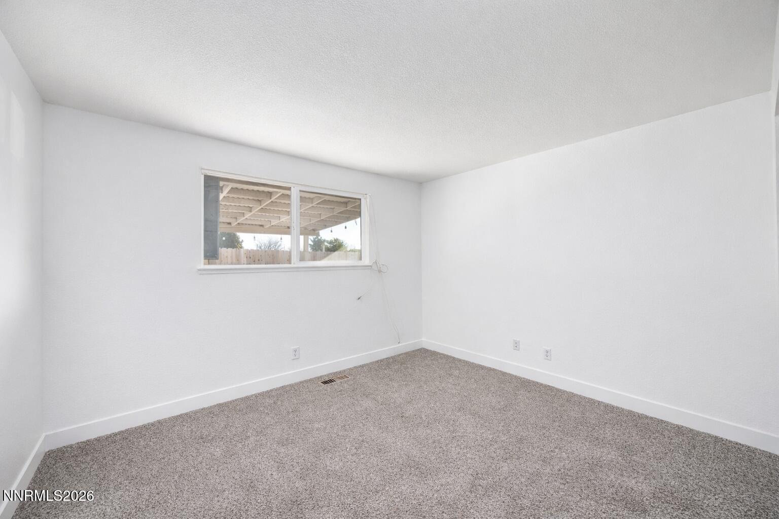 590 Fargo Way Fernley, NV 89408 - Photo 13 of 25 an empty room with a window