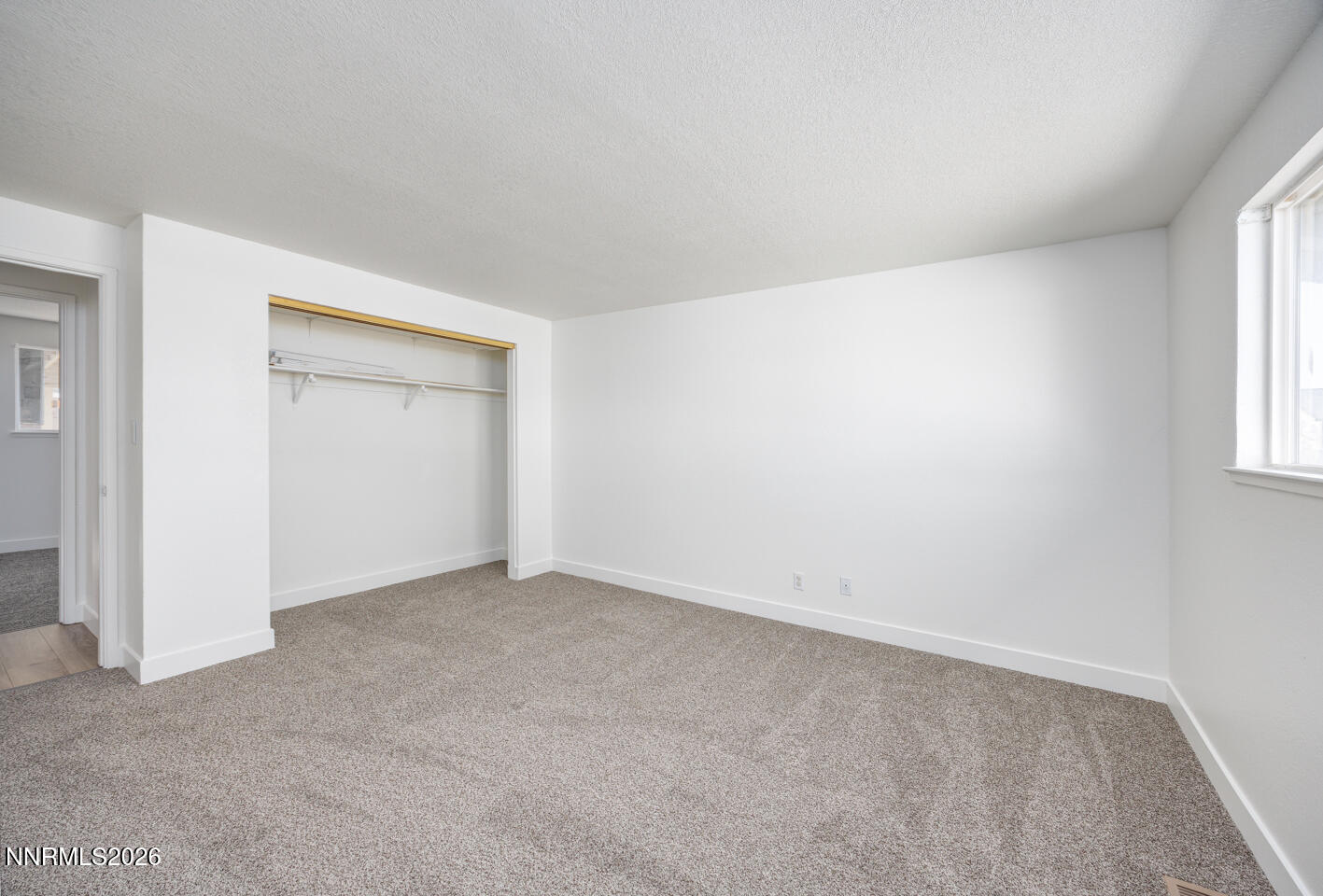 590 Fargo Way Fernley, NV 89408 - Photo 15 of 25 an empty room with windows and closet
