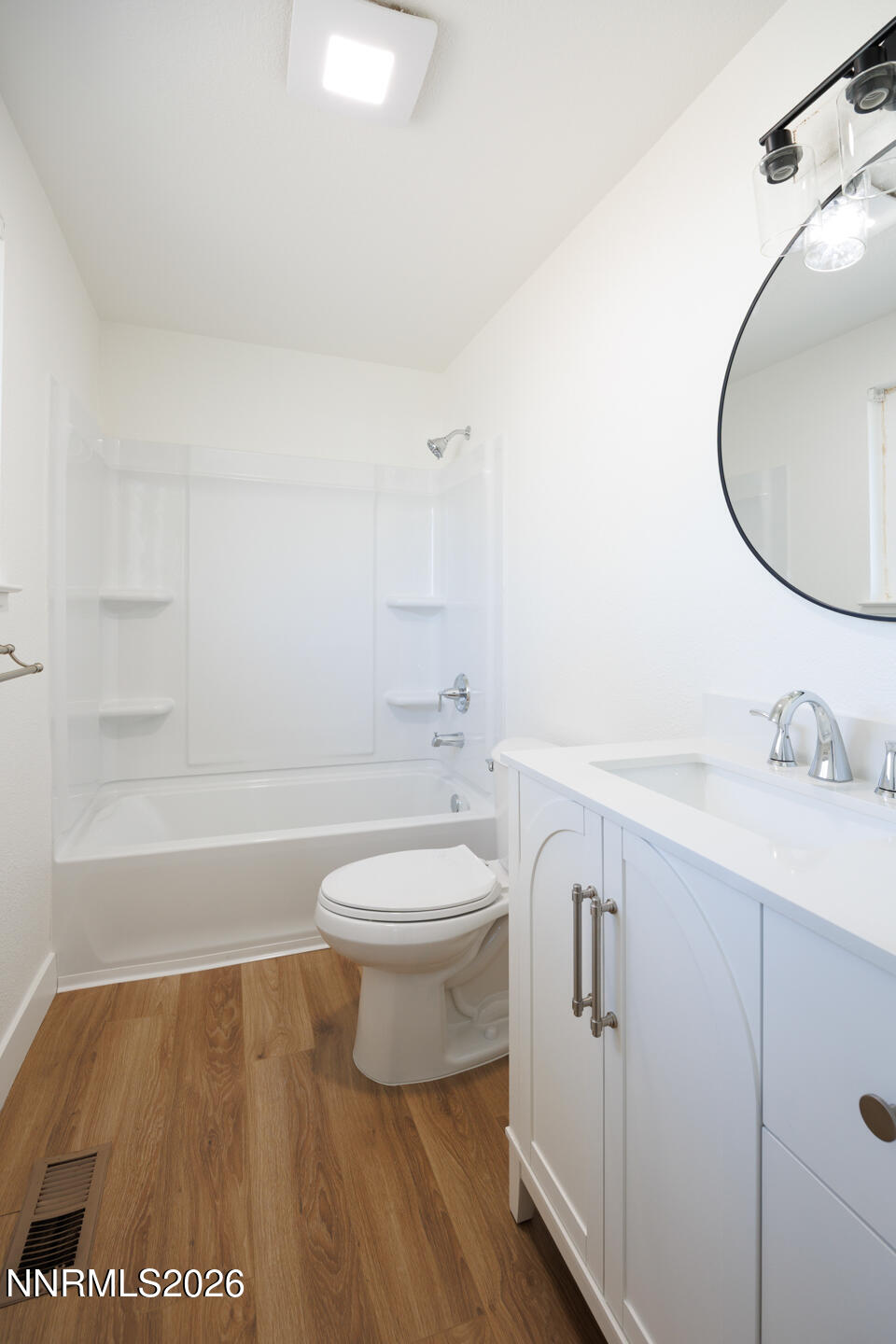 590 Fargo Way Fernley, NV 89408 - Photo 16 of 25 a bathroom with a toilet a sink and bathtub