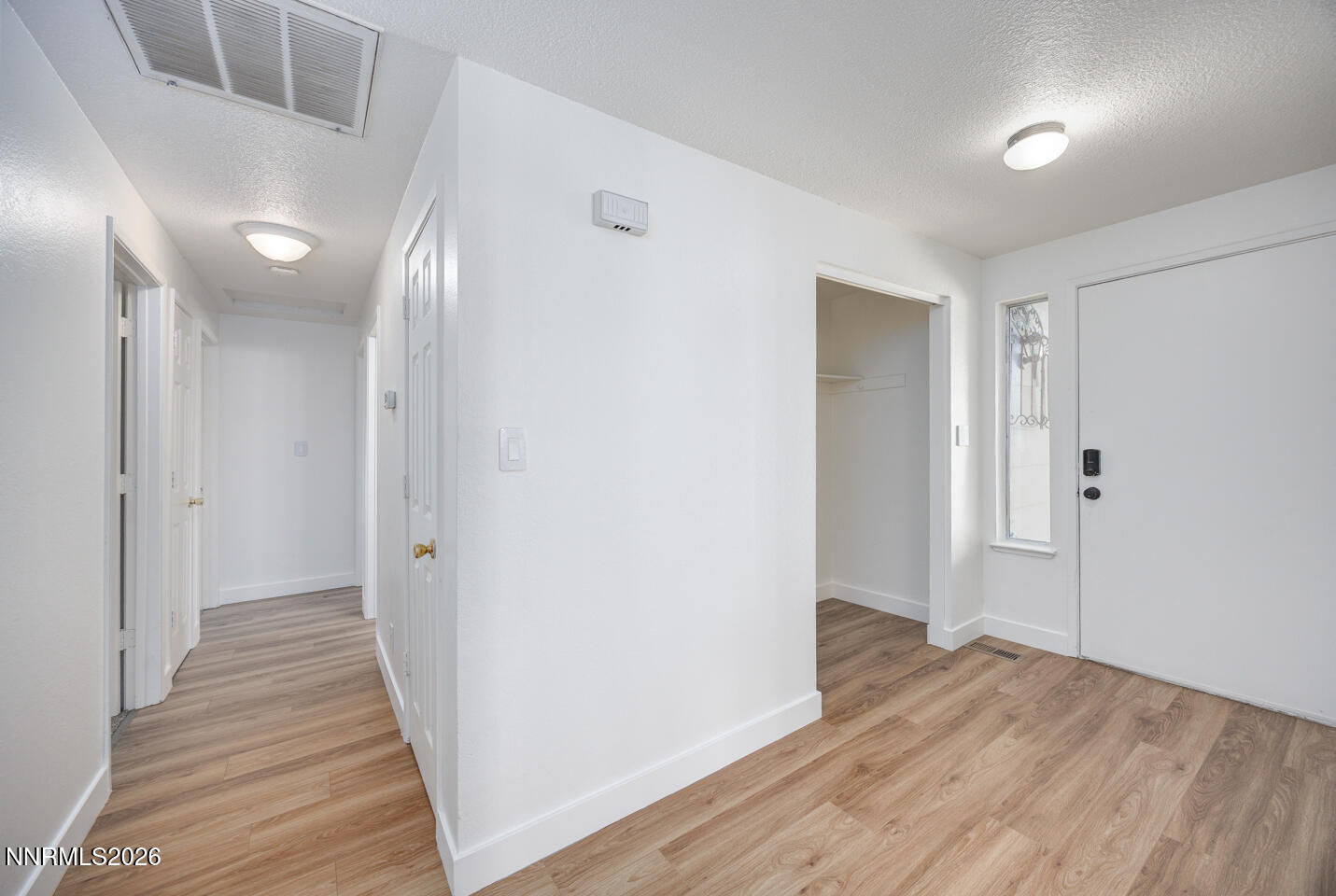 590 Fargo Way Fernley, NV 89408 - Photo 8 of 25 a view of a hallway with wooden floor