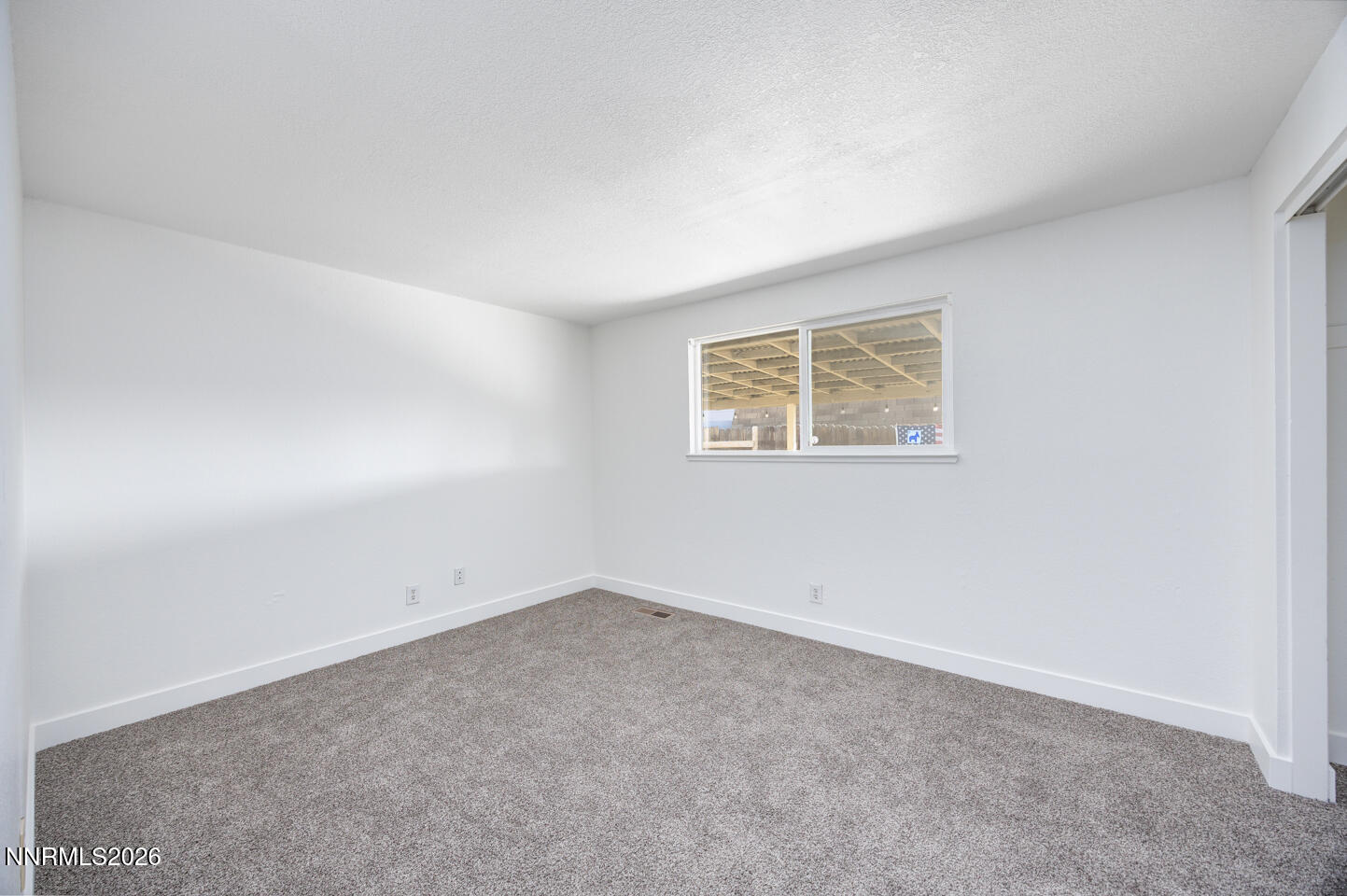 590 Fargo Way Fernley, NV 89408 - Photo 9 of 25 an empty room with a empty space and window