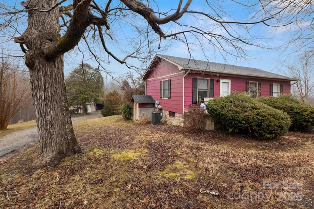 a view of a house with a snow in a yard