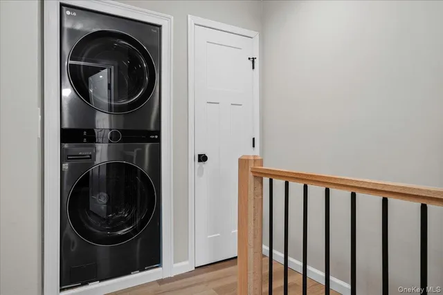 a view of a hallway with washer and dryer