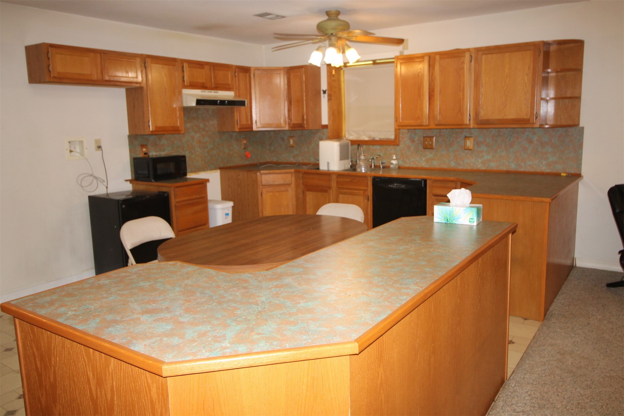 1528 County Road 2005 Liberty, TX 77575 - Photo 14 of 26 a kitchen with stainless steel appliances kitchen island granite countertop a sink a stove and a refrigerator