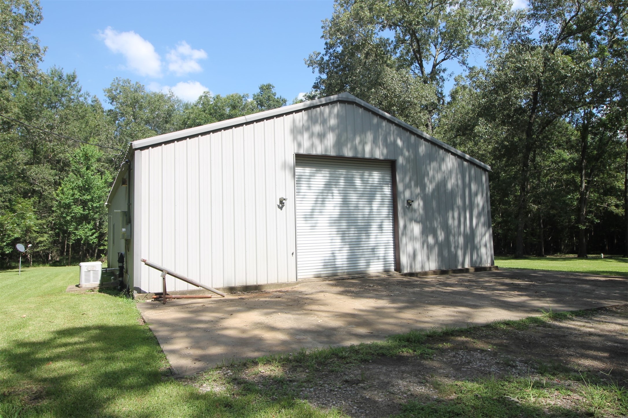 1528 County Road 2005 Liberty, TX 77575 - Photo 4 of 26 a view of a house with backyard and trees