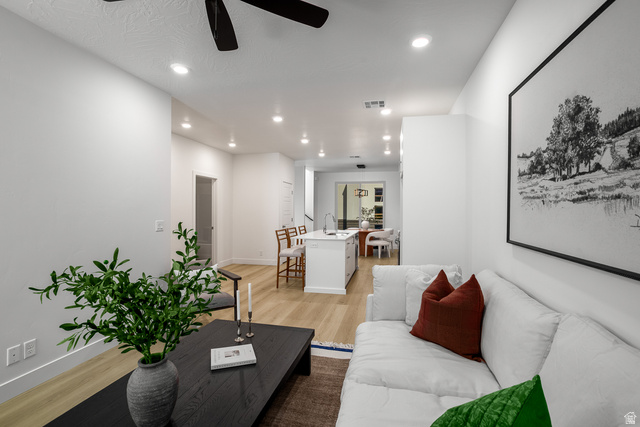 2768 Becco Trail, Unit 63 St. George, UT 84770 - Photo 6 of 27 Living area featuring light wood-style floors, ceiling fan, and recessed lighting