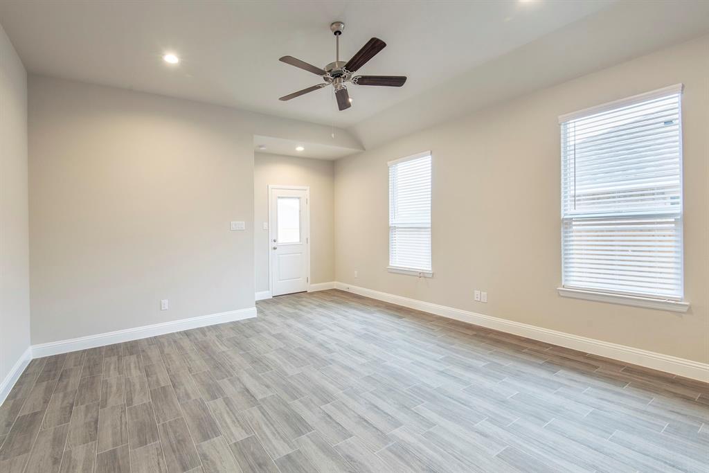 2301 Ruff Road Denton, TX 76205 - Photo 4 of 23 Spacious living room featuring wood-look tile flooring, recessed lighting, and a ceiling fan