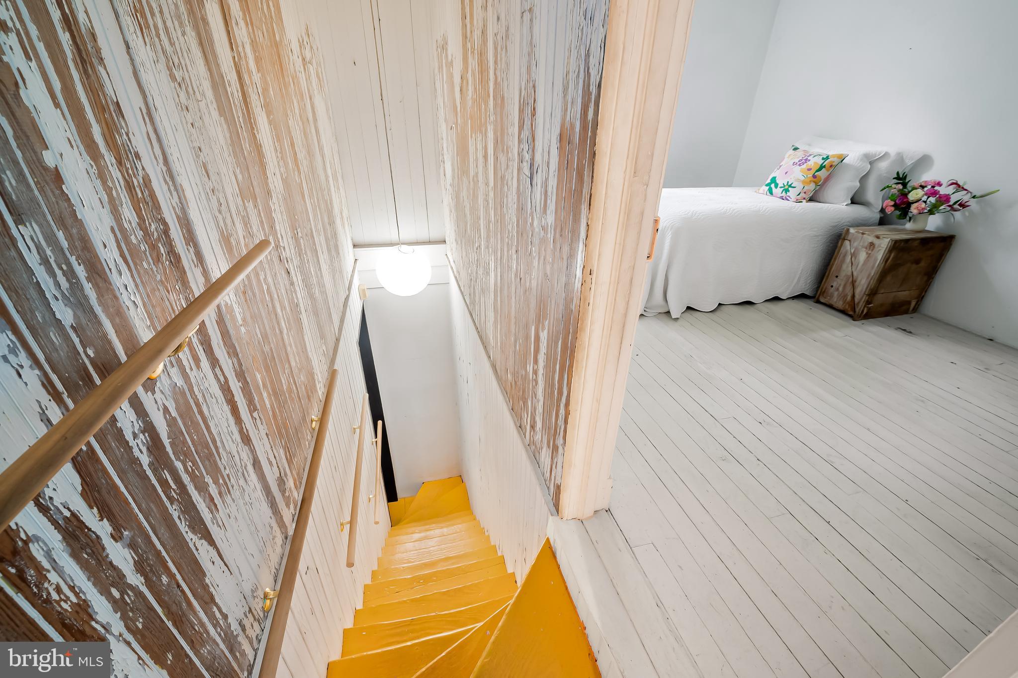 7901 Ruxwood Road Baltimore, MD 21204 - Photo 60 of 85 a bedroom with a bed and wooden floor