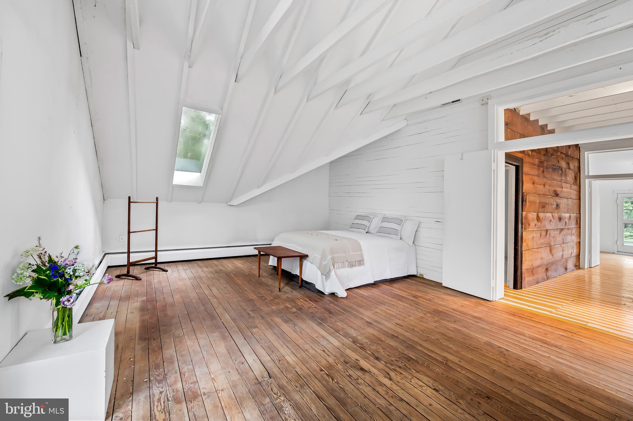 7901 Ruxwood Road Baltimore, MD 21204 - Photo 66 of 85 a view of a room with wooden floor and potted plant