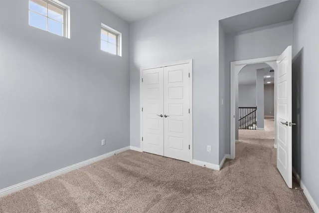 a bathroom with a sink toilet vanity and shower