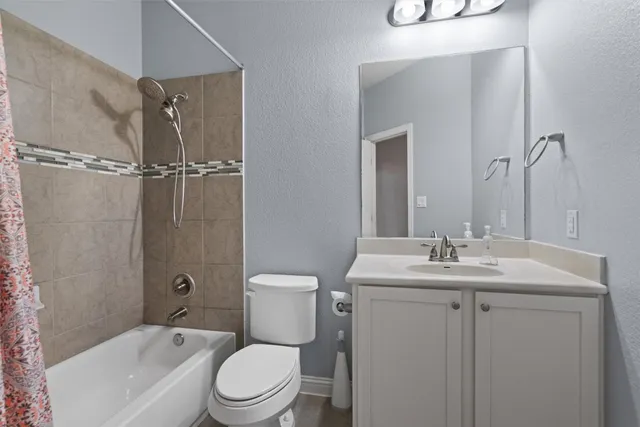 a view of an empty room with a bathroom