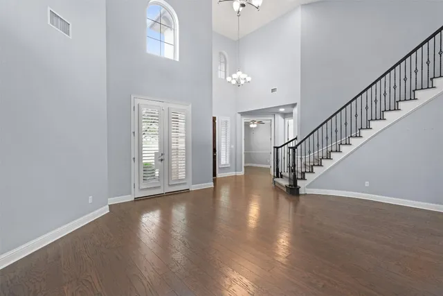 a view of an entryway with wooden floor
