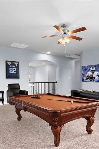 a view of a room with wooden floor and windows