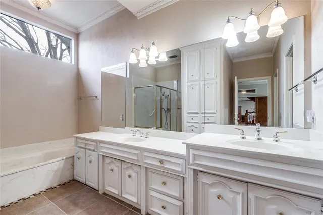 a bathroom with a sink double vanity and a mirror