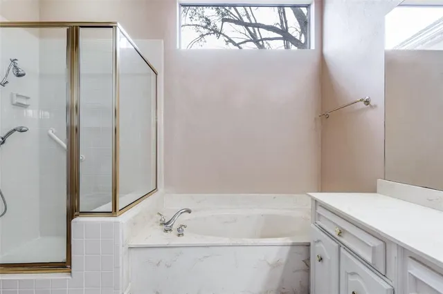 a bathroom with a bathtub and a sink