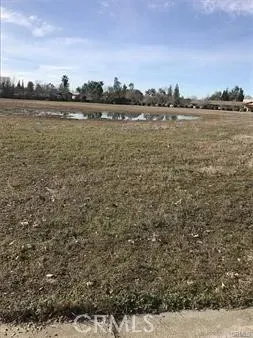 a view of a lake with houses in the back