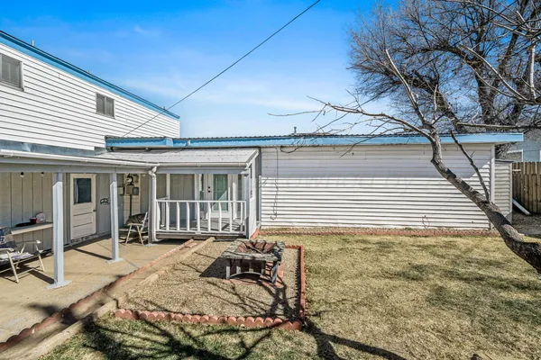 a room with pool table and windows