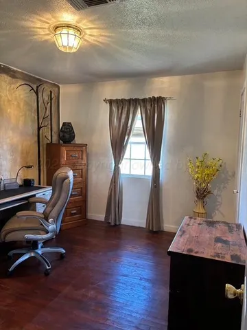 a workspace with furniture and window