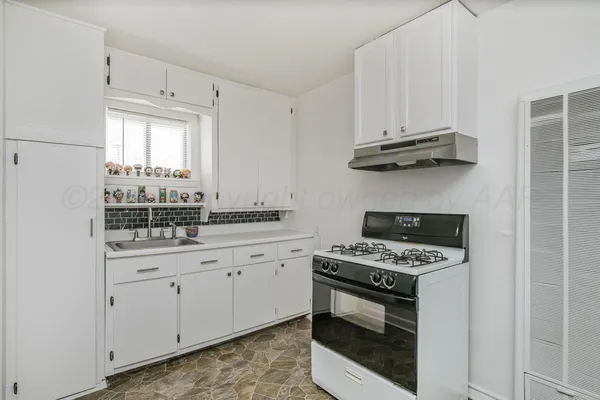 a bathroom with a sink a mirror and vanity