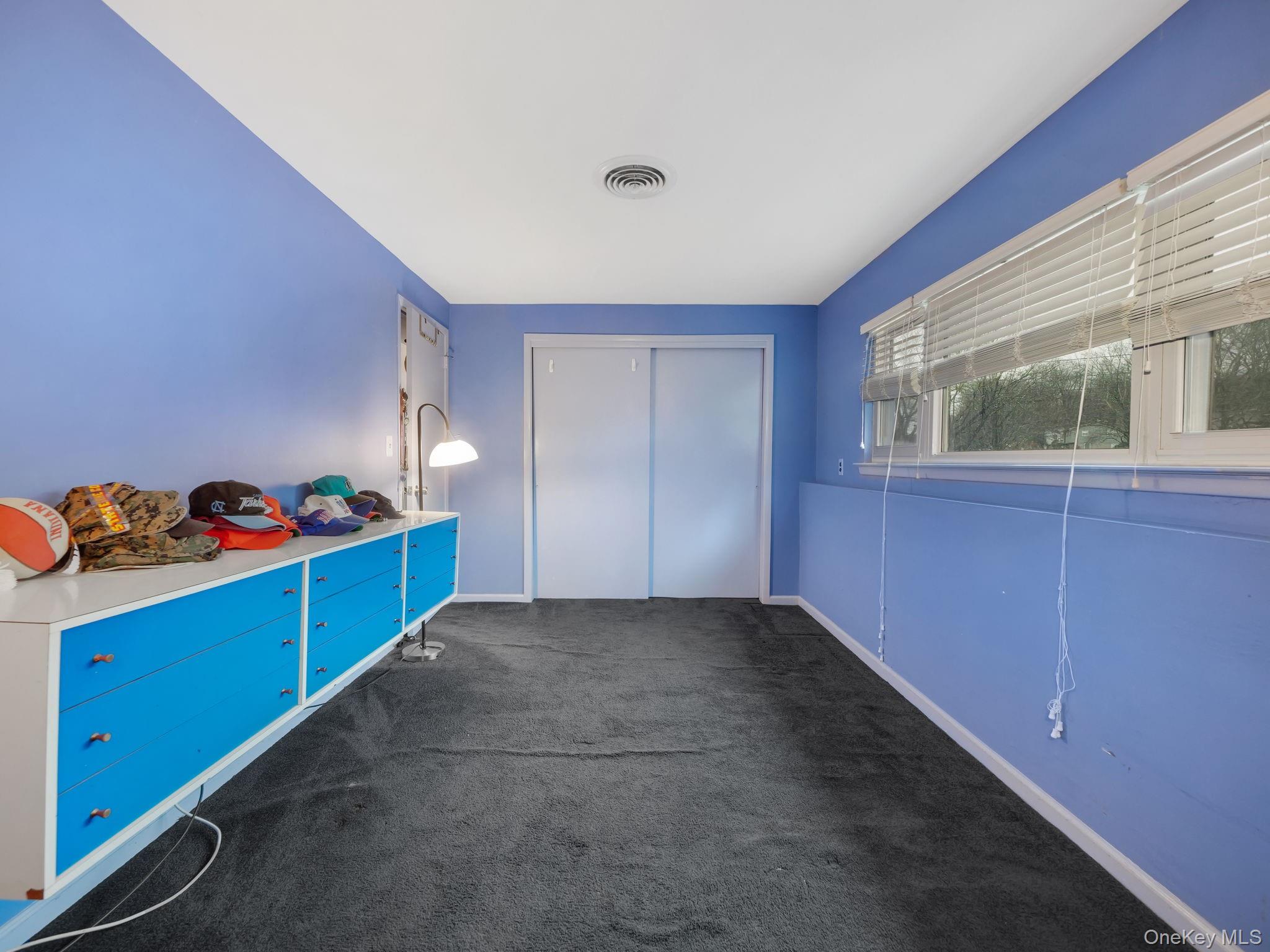 6 Pennington Way Spring Valley, NY 10977 - Photo 19 of 34 Unfurnished bedroom with a closet and dark colored carpet