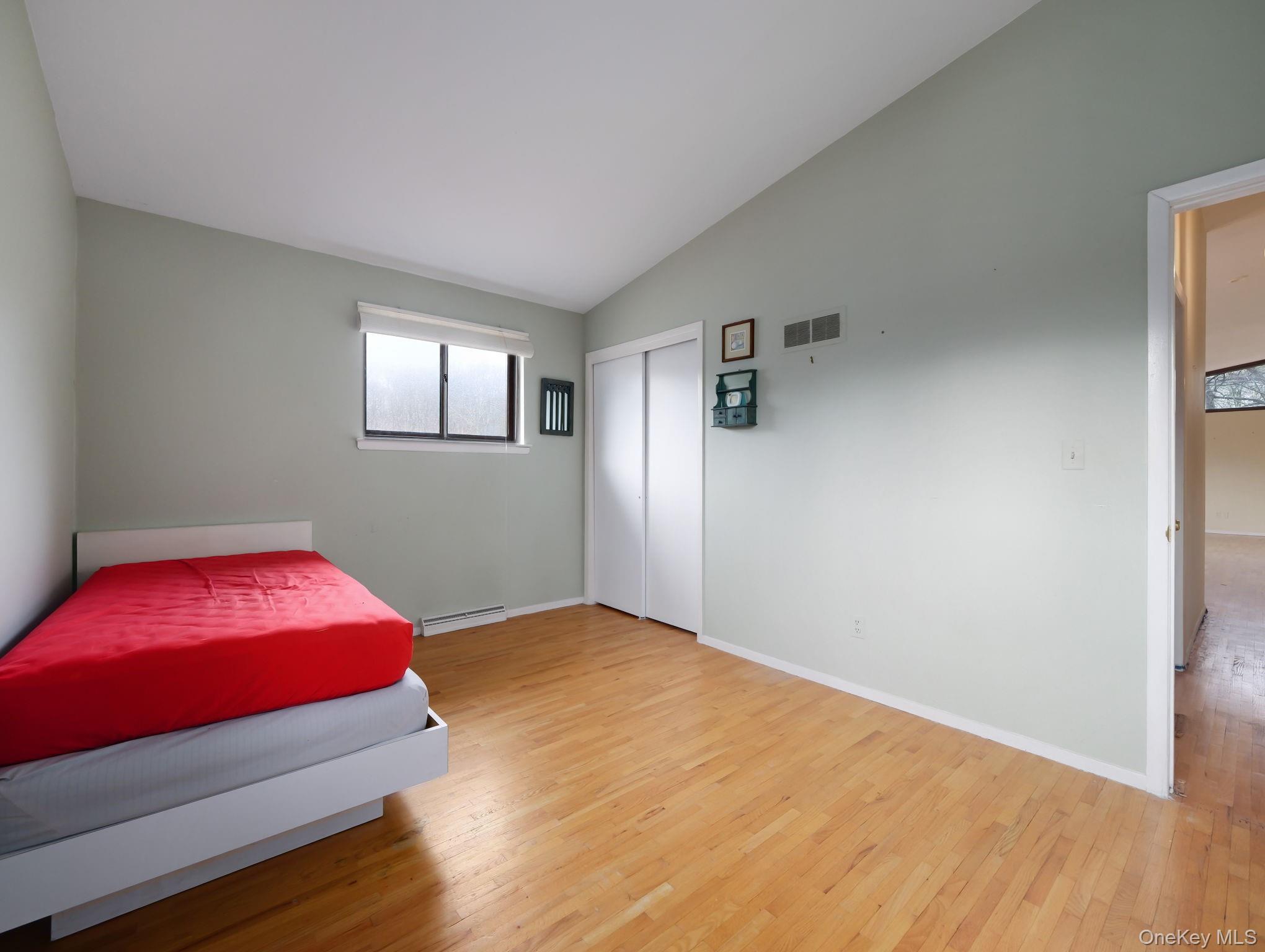6 Pennington Way Spring Valley, NY 10977 - Photo 22 of 34 Bedroom featuring vaulted ceiling, hardwood / wood flooring,