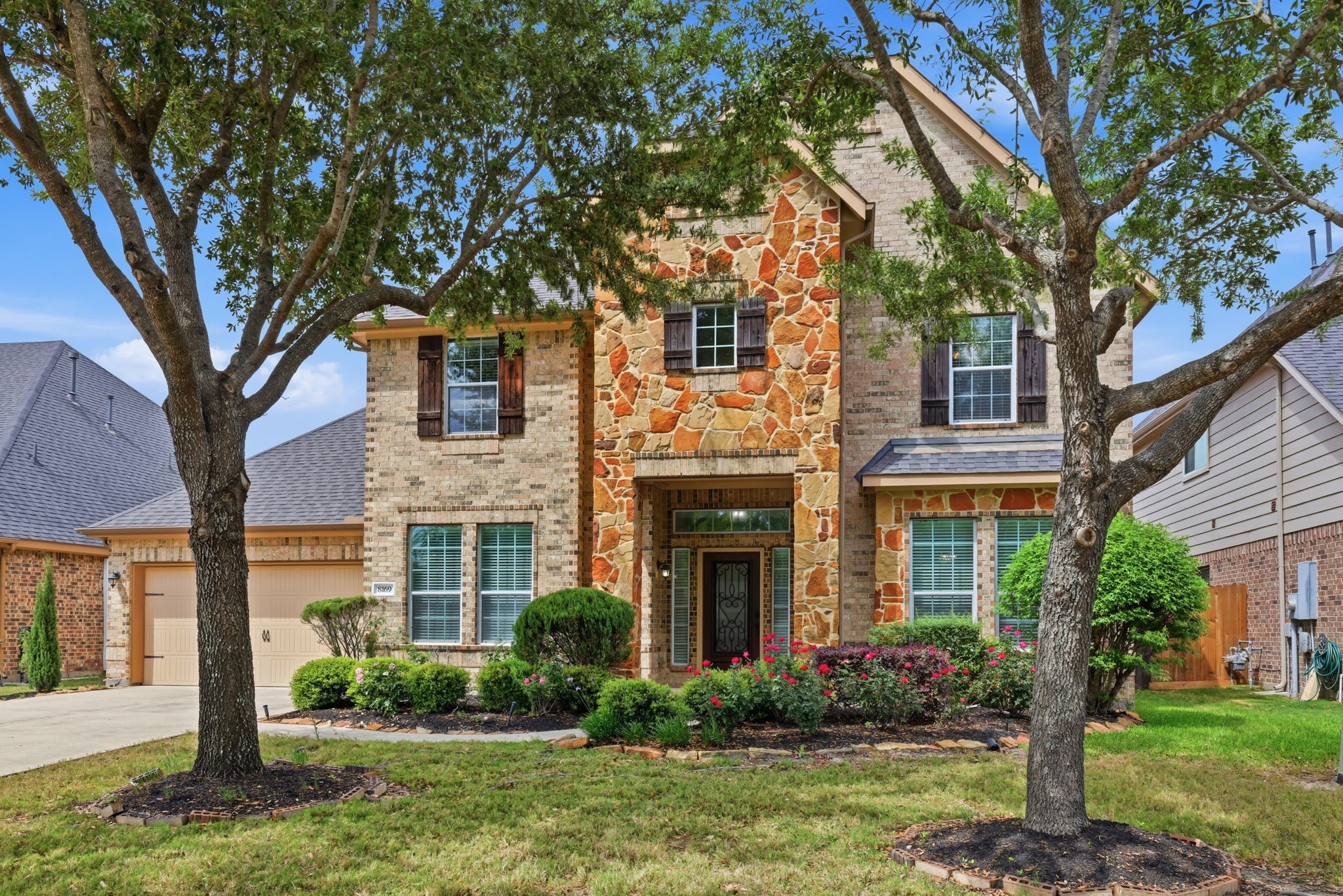 8169 Tranquil Lake Way Conroe, TX 77385 - Photo 2 of 26 front view of a house with a yard