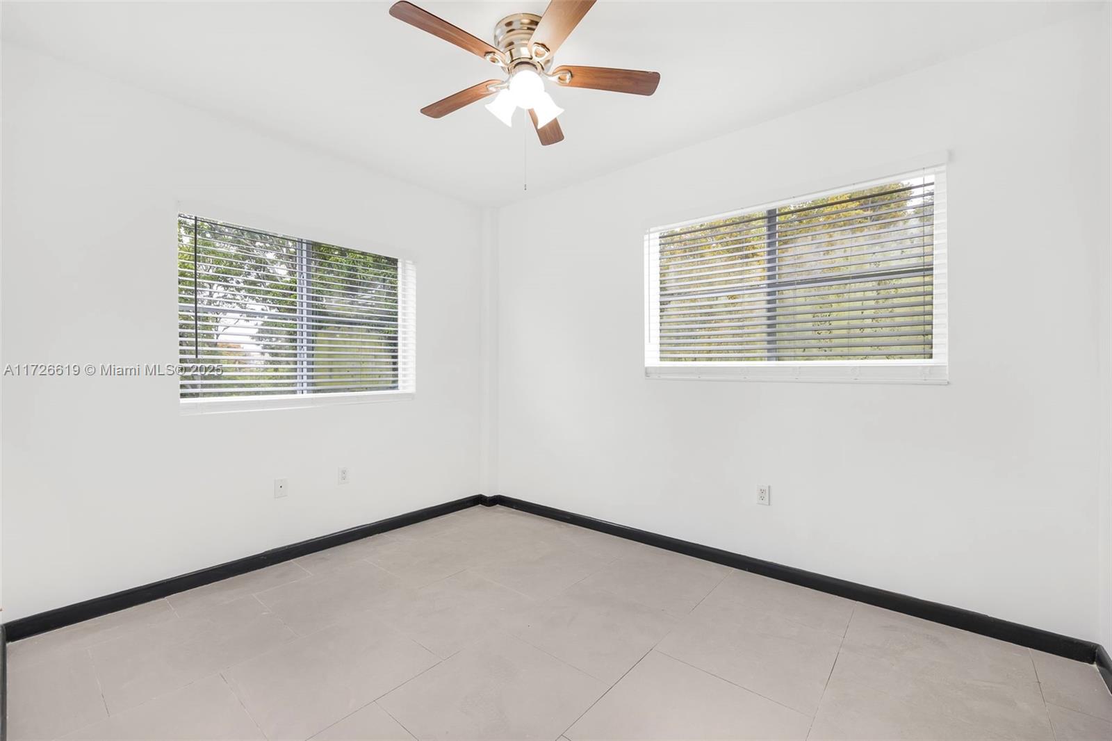 1876 Southwest 11th Terrace, Unit 302 Miami, FL 33135 - Photo 13 of 15 a view of an empty room with a window