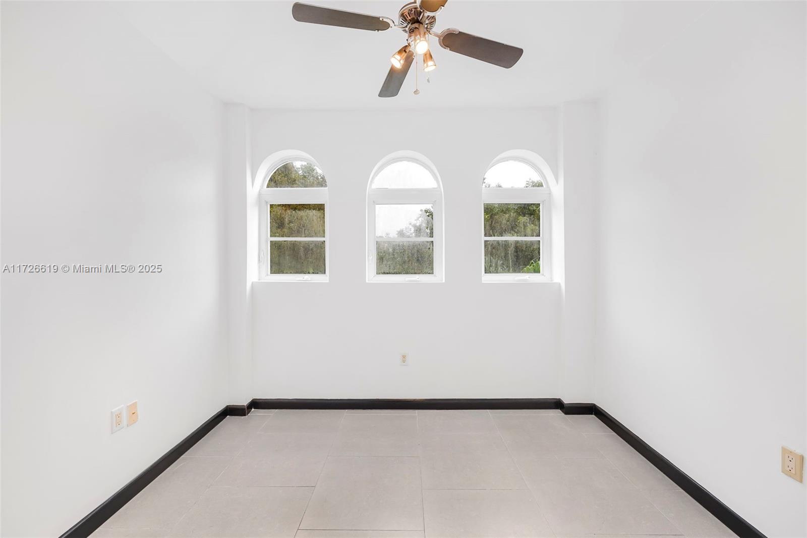 1876 Southwest 11th Terrace, Unit 302 Miami, FL 33135 - Photo 14 of 15 a view of an empty room with a window