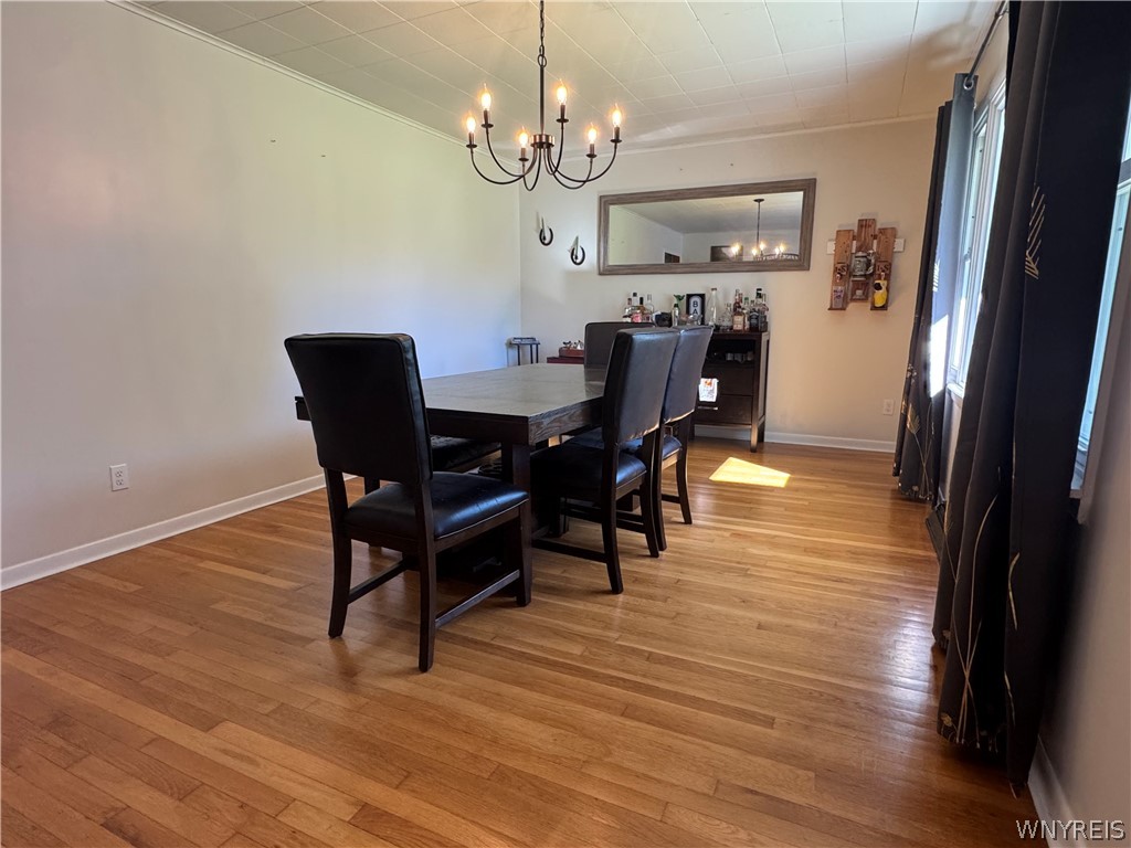 10180 Partridge Road Colden, NY 14080 - Photo 4 of 34 Gleaming hardwood floors and a classic chandelier define this welcoming dining room.
