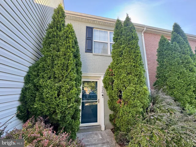 a house with a trees in front of it