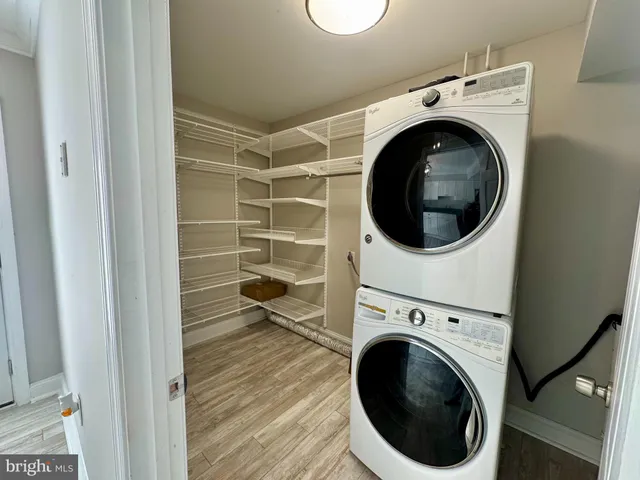 a view of walk in closet with empty racks