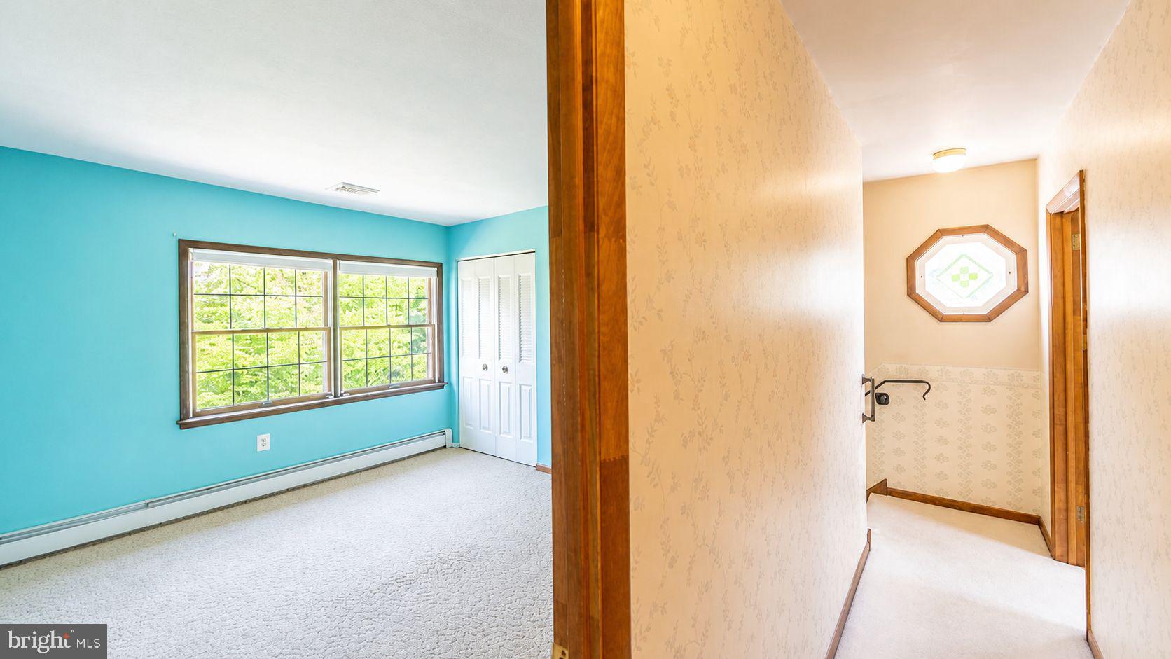 223 Trythall Road Elverson, PA 19520 - Photo 46 of 78 a view of hallway with a large window and entryway