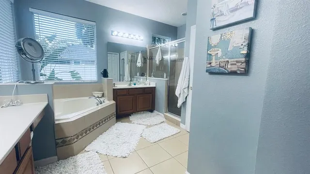 a bathroom with a bathtub and a shower