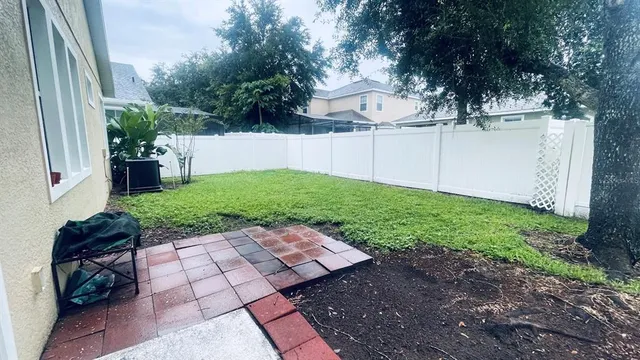 a backyard of a house with lots of green space