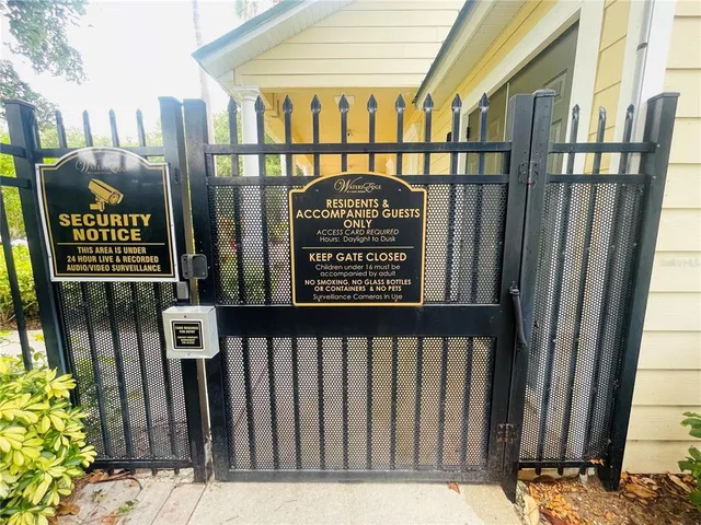 a view of a wooden fence with a sign board
