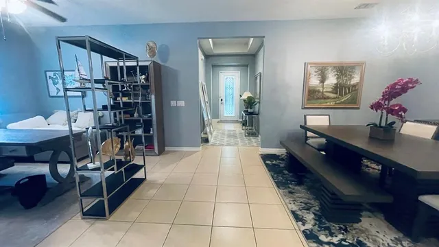 a lobby with furniture and book shelf