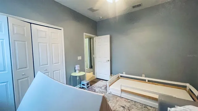 a bedroom with a bed and a table