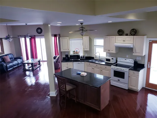 a kitchen with cabinets a sink and appliances