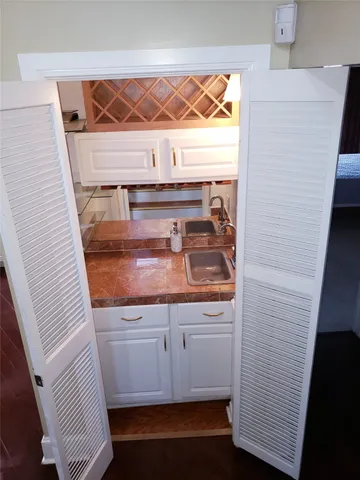 a spacious bedroom with a bed and a couch