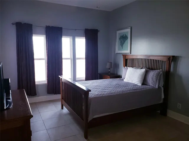 a bedroom with a bunk bed and a dresser